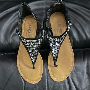 Black suede studded sandals with back zip. Worn